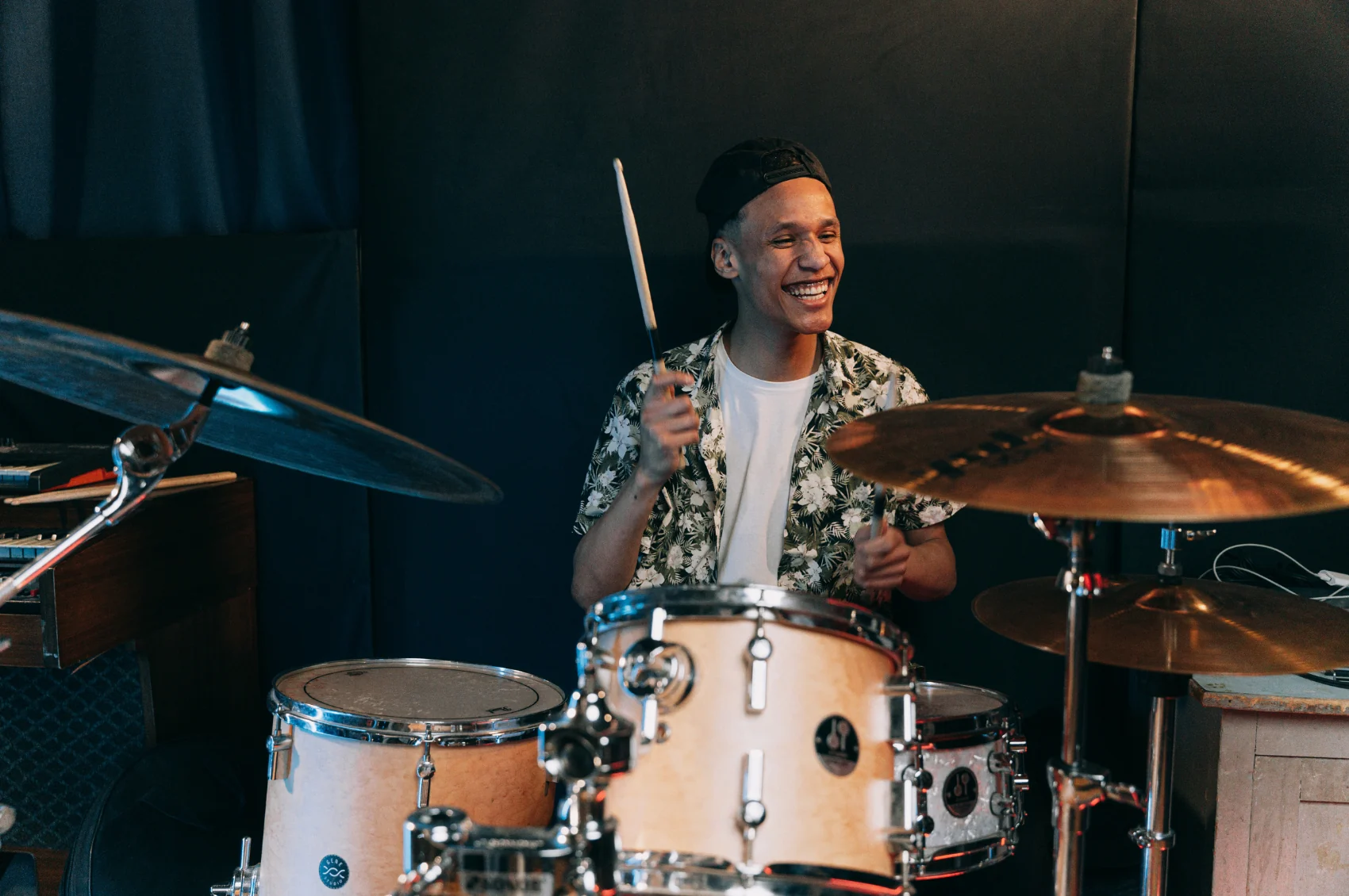 A drummer playing a drum kit