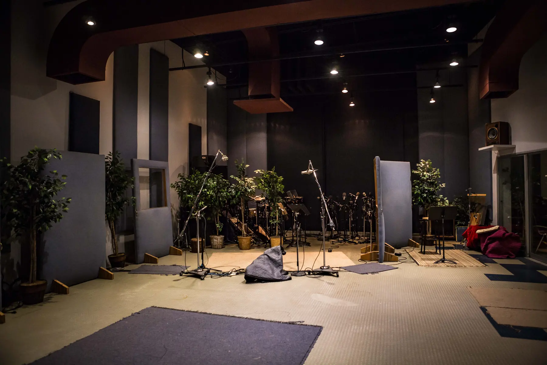 The live room at the Music 4 Humans studio in southwest Denver: acoustic panelling, microphone stands and a drum kit under a high ceiling